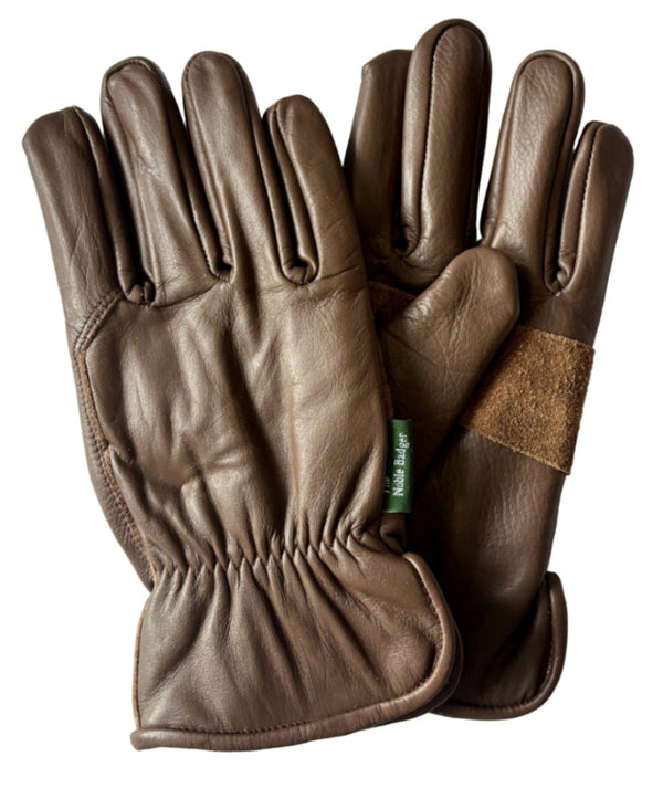 Brown leather gloves with a brand label on a white background